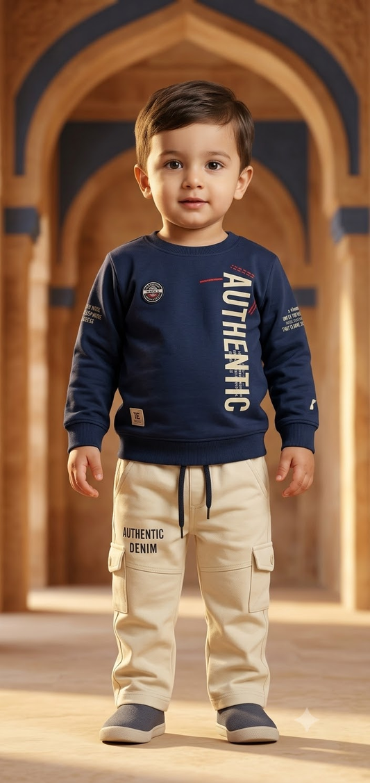 Boy wearing navy graphic top and cream cargo pants