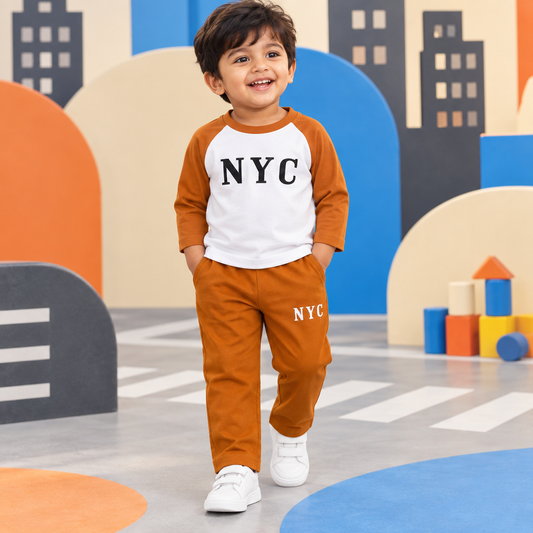 Toddler boy wearing NYC graphic raglan T-shirt and matching jogger set with a clean covered waistband