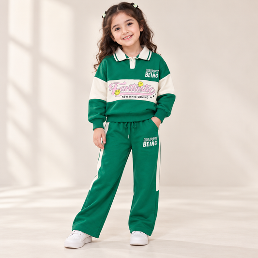 Girl wearing green and cream collared Fantastic graphic top and matching wide-leg pants
