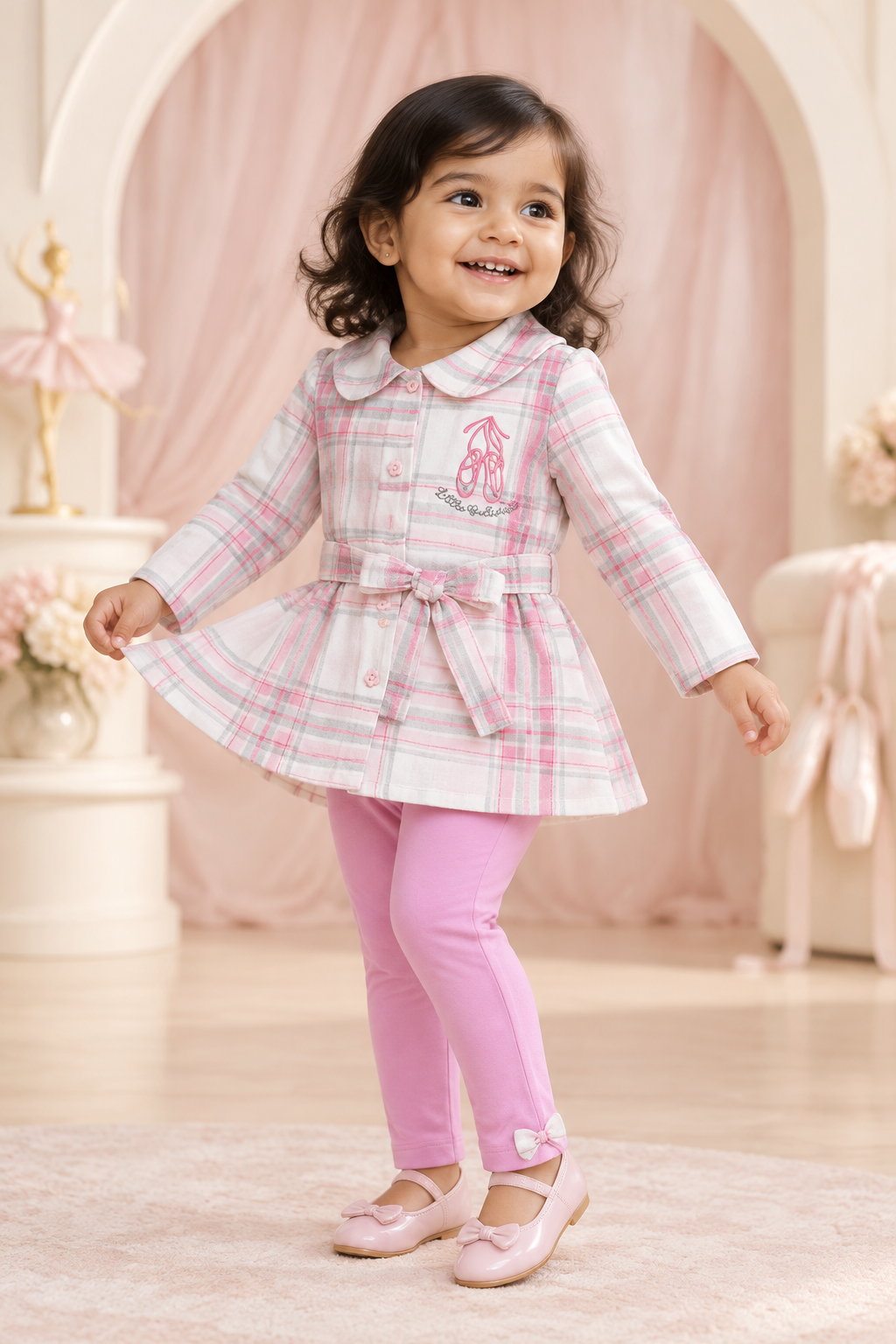 Toddler girl wearing checked ballerina tunic and pink leggings