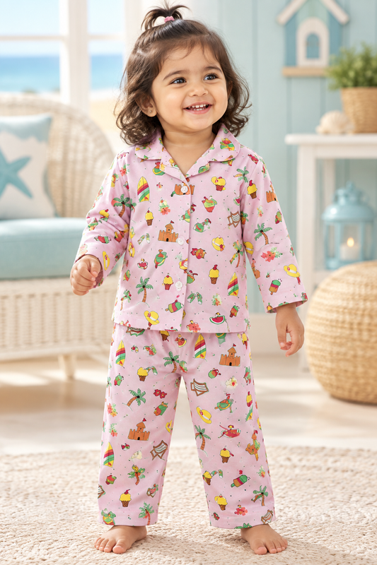 Toddler girl wearing pink beach print top and matching pyjama bottom