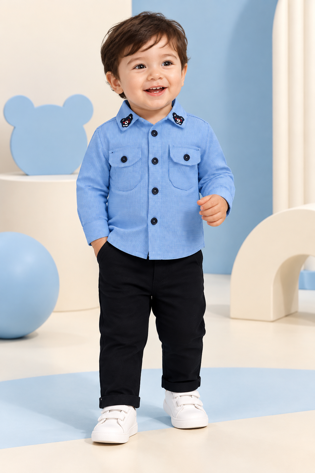 Toddler wearing blue bear-detail shirt and black pants