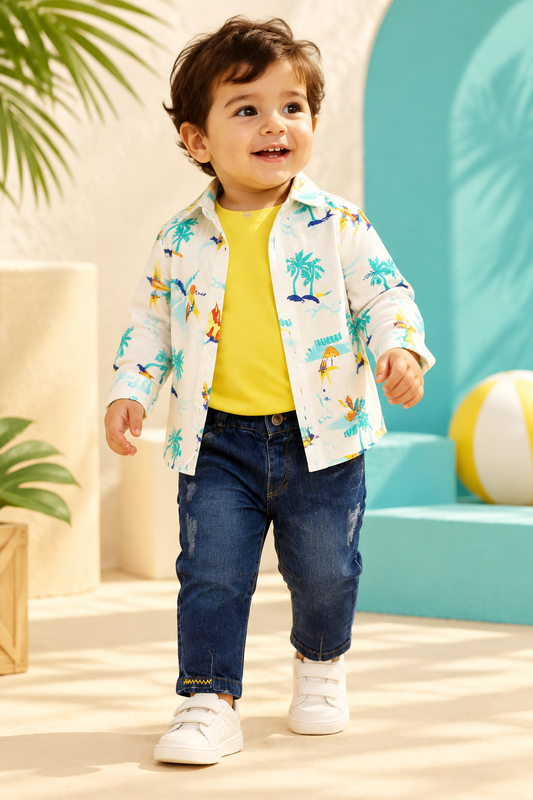 Toddler wearing white tropical-print shirt over yellow tee with dark denim jeans