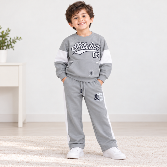 Boy wearing a grey Pitcher graphic sweatshirt with white sleeve panels and matching grey pants with white side stripes