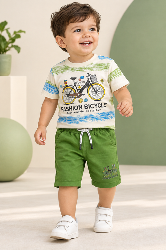 Toddler wearing bicycle-print cream T-shirt and green capri pants